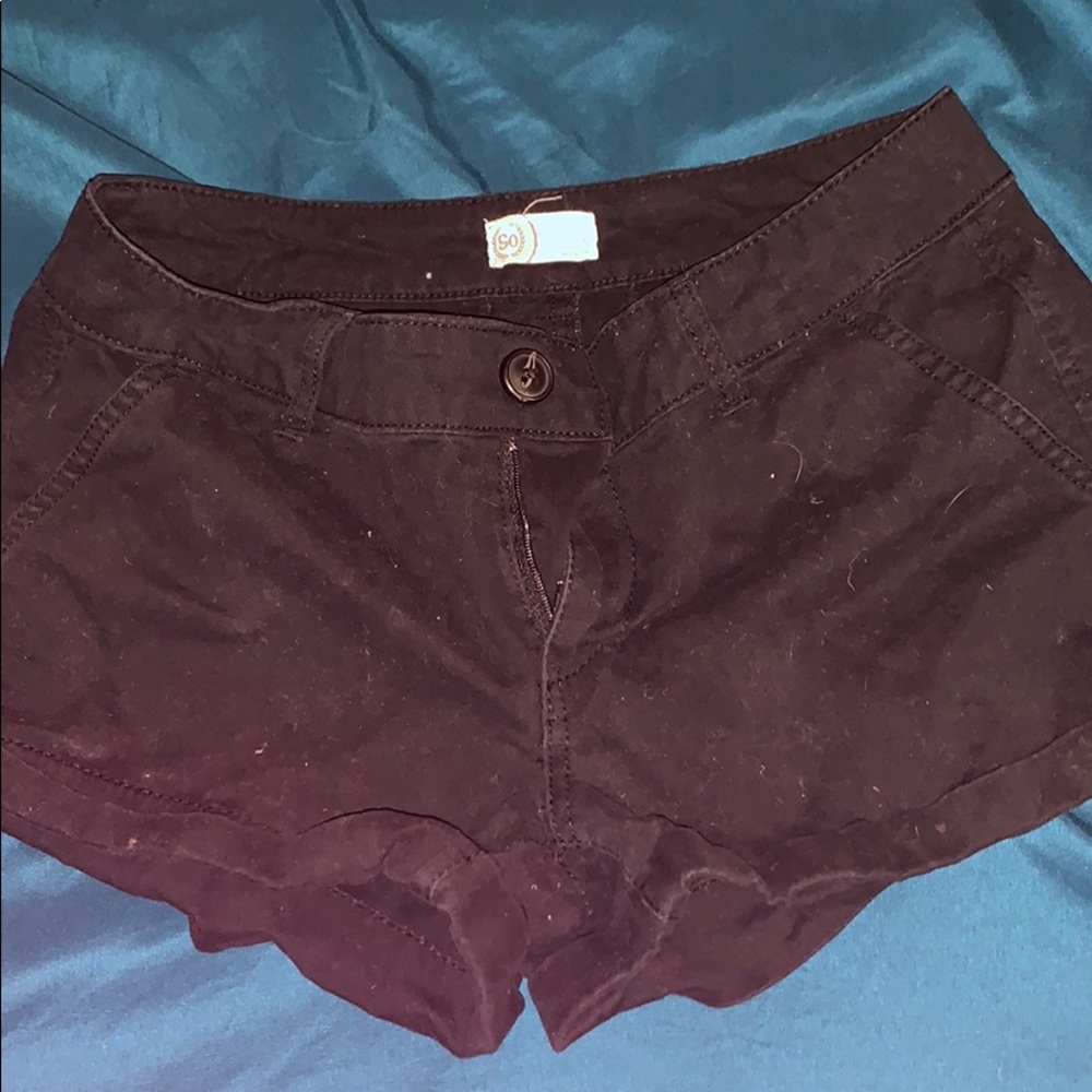 a pair of youth black shorts